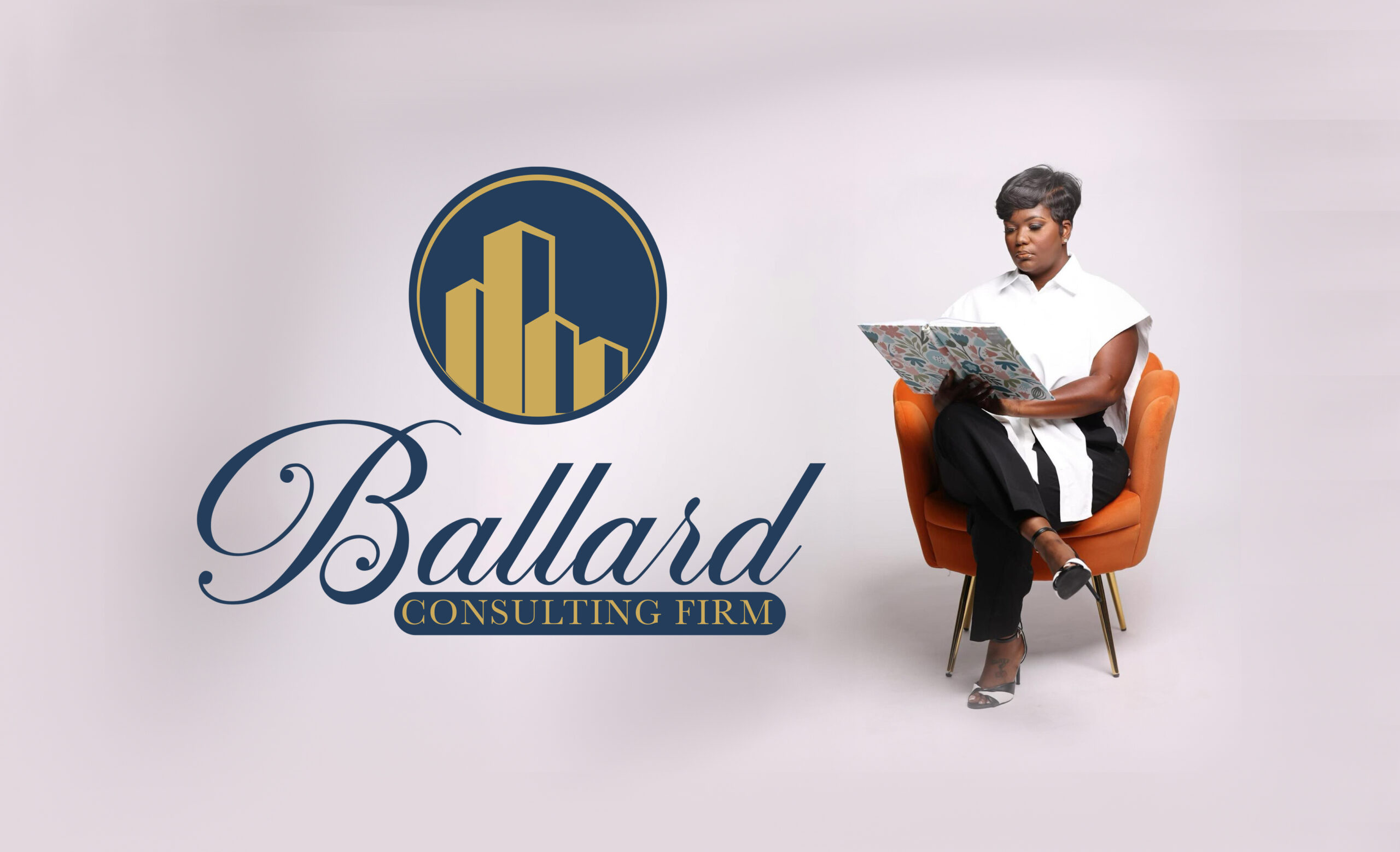 Teritha Ballard, founder of Ballard Consulting Firm, seated and reading