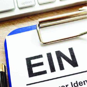 A close-up view of an Employer Identification Number (EIN) application form, displaying various sections for essential business information.